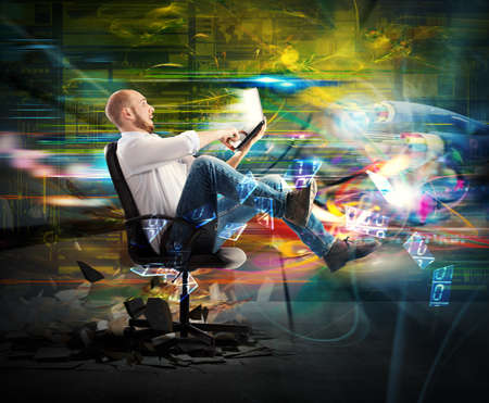 Amazed businessman quickly transported from his laptop Amazed businessman quickly transported from his laptop
