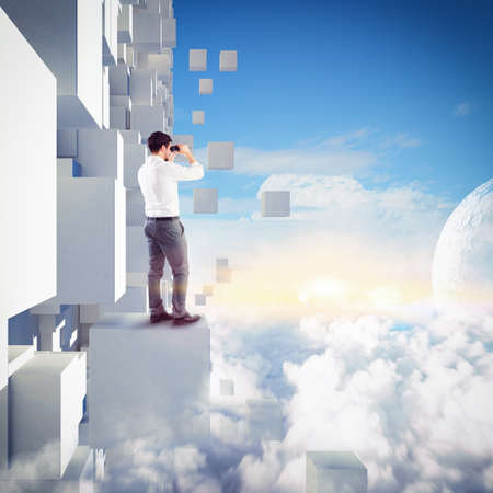Businessman watching with binoculars from a building