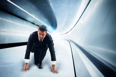 Businessman in a futuristic tunnel with lights