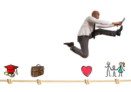 Successful businessman jumps on a life rope