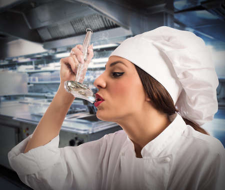 Chef tasting the dish from a ladleの写真素材