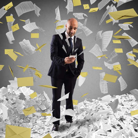 Man with cellphone with background of lettersの写真素材