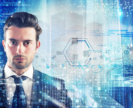 Businessman with blue futuristic background with cityの写真素材
