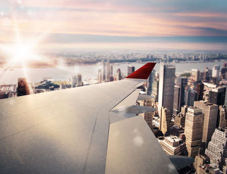 3D rendering of aircraft above the cityの写真素材