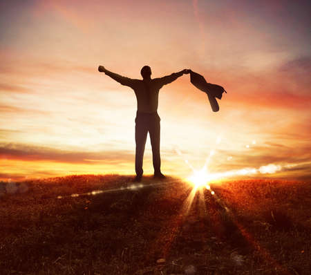 Man on a hill at the sunsetの写真素材