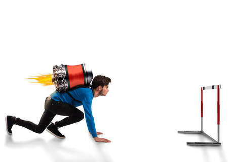 Boy with rocket on his back looks an obstacleの写真素材