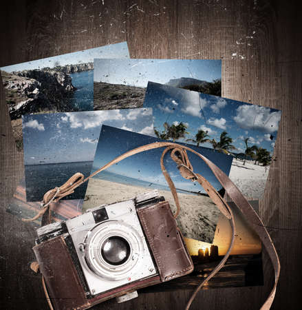Vintage camera with leather belt and landscape photographyの写真素材