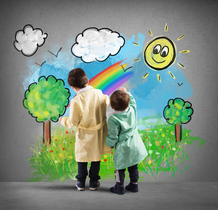 Children draw on the wall a colorful landscapeの写真素材