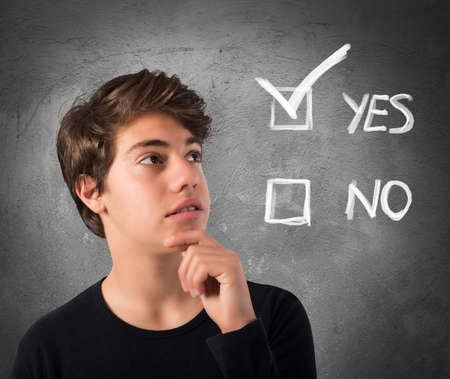 Teenage Boy with thoughtful expression and checkboxes
