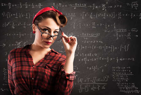 Woman pin-up style with eyeglasses and blackboardの写真素材