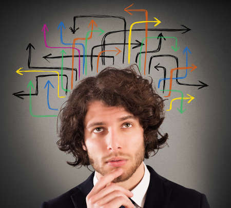 Man with a questioning expression and design of arrows over his head
