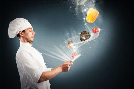Chef looks stunned vegetables that come from tablet