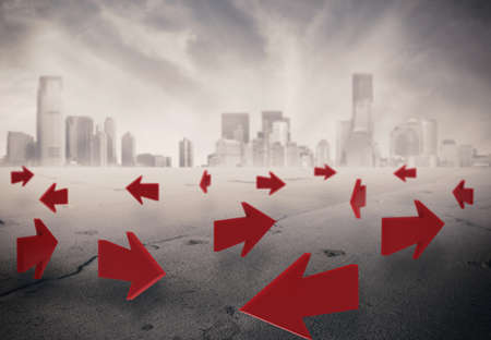 3D Rendering of arrows on asphalt with a cityscape on backgroundの写真素材