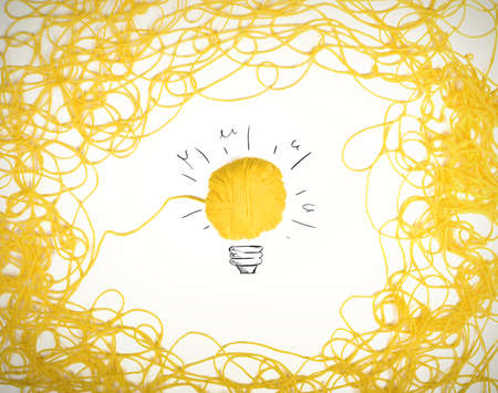 Concept of idea and innovation with tangle of wool yarnの写真素材