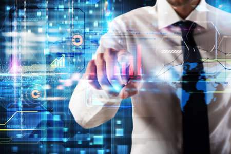 Businessman touching a virtual screen of business analysisの写真素材