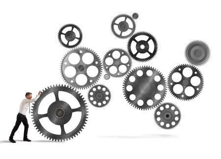 Businessman builds a business system as a gears mechanismの写真素材