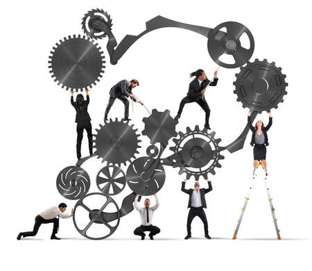 Teamwork of businesspeople work together to a system of gearsの写真素材