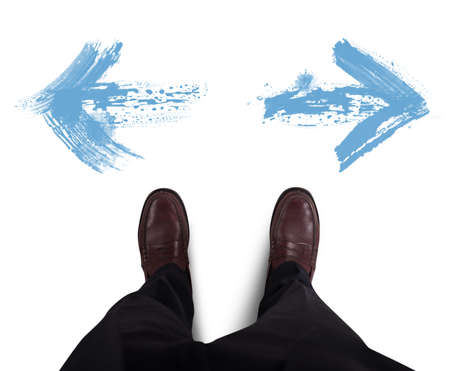 Businessman chooses which directional white arrow follow