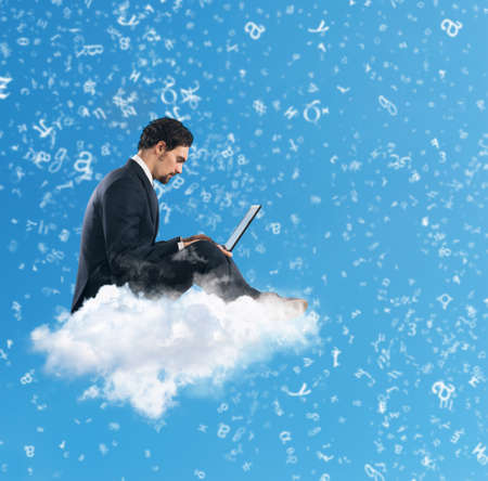 Businessman with laptop on a cloud in the sky. Internet and social network concept
