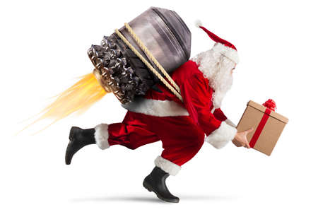 Santa Claus with gift box flies with a missileの写真素材