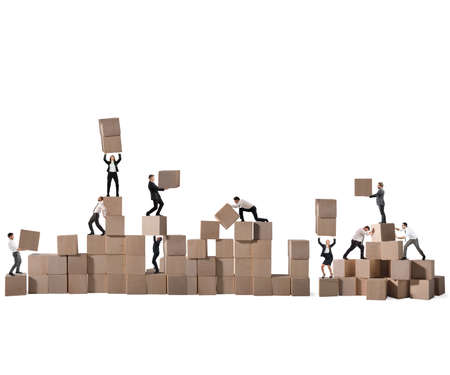 Business person built together a wood cubes constructionの写真素材