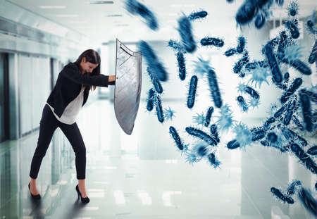 3D Rendering. woman protects with the shield by an attack of bacteriaの写真素材