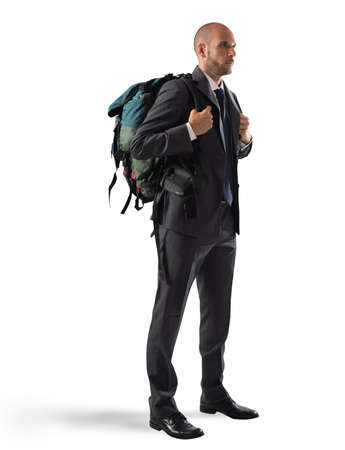 Businessman with elegant suit and explorer backpackの写真素材