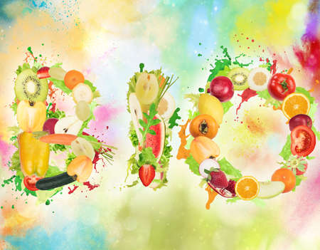 Fruit and vegetables forming the word bio with splashes of color. Healthy Bio food for wellness conceptの写真素材