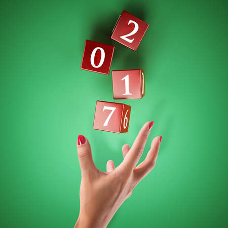 Dice rolled by a hand. Bet on the happy new year concept