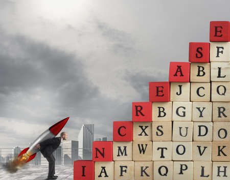Enterprising businessman with missile wants to climb the scale cubes with written increaseの写真素材
