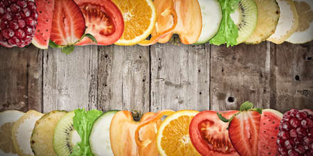 Colourful fruit banner on wood background. Healthy food conceptの写真素材