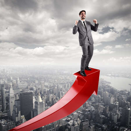 Businessman exults for economic successの写真素材