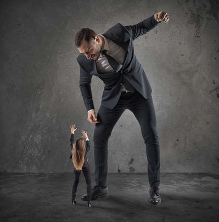 Humiliation and violence at workの写真素材