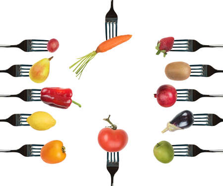 Background of forks with various vegetables and fruitsの写真素材