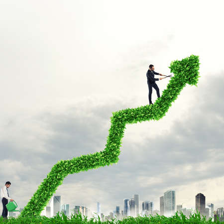 Big plant that grows like an arrow. Growing the economy companyの写真素材