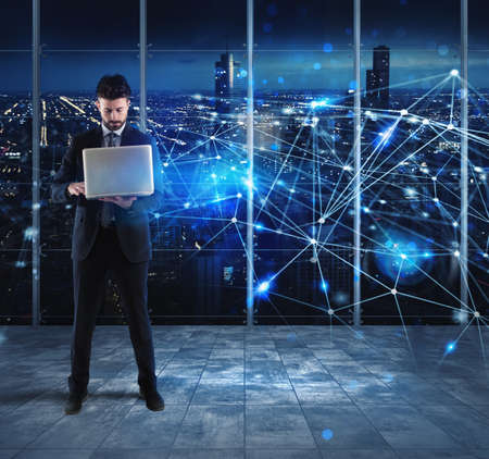Businessman works with laptop and internet networkの写真素材