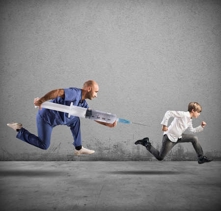 Fear of the vaccine concept with running childの写真素材