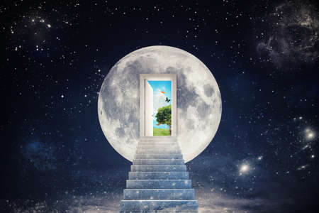 Staircase leads to a door to the moon that opens to a new worldの写真素材