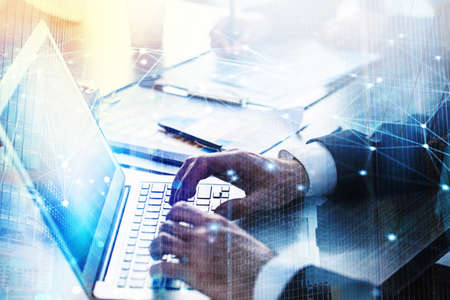 Businessperson in office connected on internet network with a laptop. concept of partnership and...