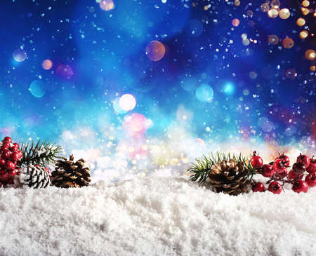 Christmas element on the snow with pine and garland