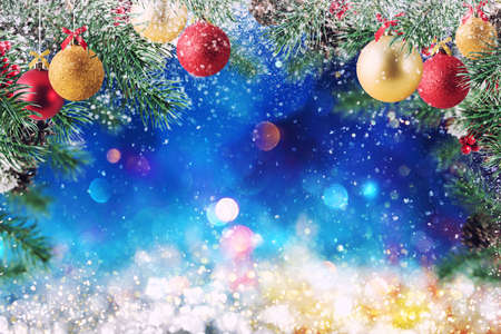 Christmas decoration with snow, pine and ball with sparkly background