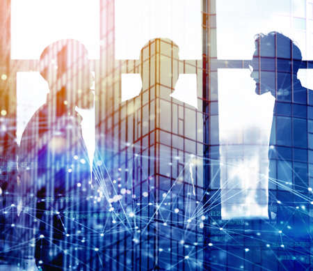 Businessmen that work together in office with network connection effect. Concept of teamwork and...