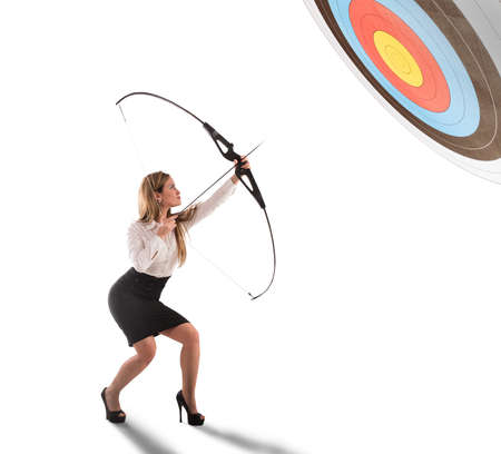 Businesswoman point to success in business with arrowの写真素材
