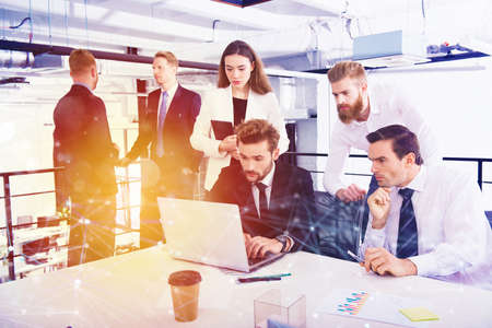 Businessperson in office connected on internet network. concept of partnership and teamworkの写真素材