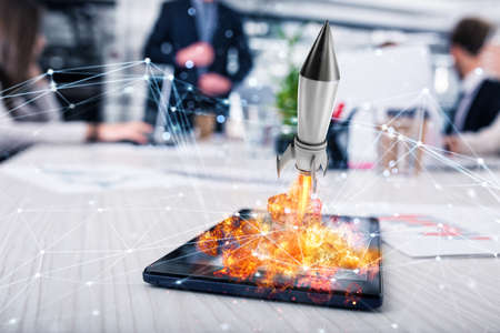 Rocket ready to starts from a tablet. concept of company startup