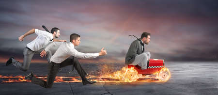 Fast businessman with a car wins against the competitors. Concept of success and competition