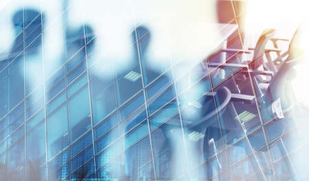 Businessmen that work together in office. Concept of teamwork and partnership. double exposureの写真素材