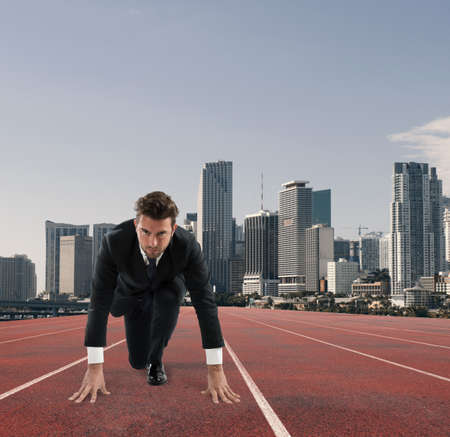 Businessman acts like a runner. Competition and challenge in business conceptの写真素材