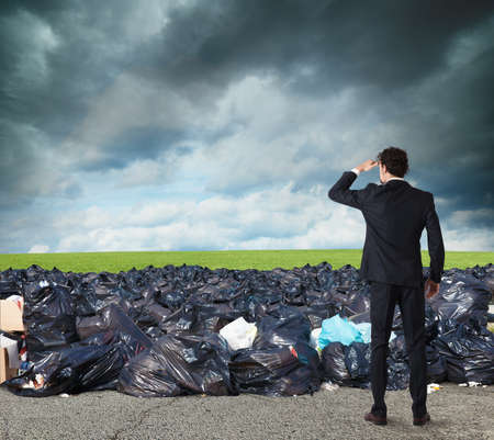 Businessman searches far for clean environment. overcome the global pollution problemの写真素材