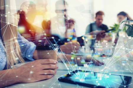 Businessperson in office connected on internet network. concept of partnership and teamworkの写真素材